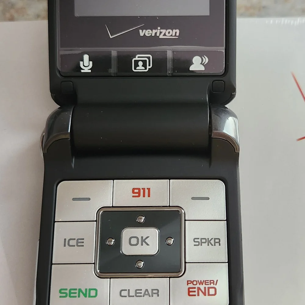 Verizon Flip Phone with Silver and Black Design